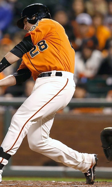 Posey's 3 RBI power Giants past Braves, into first place